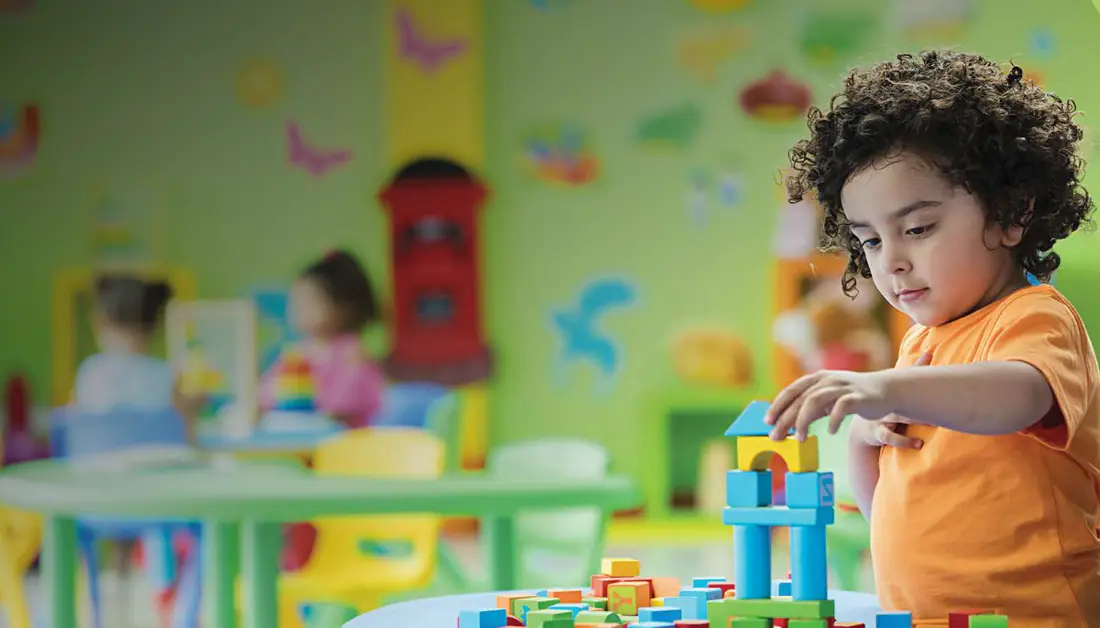 Child playing with building blocks