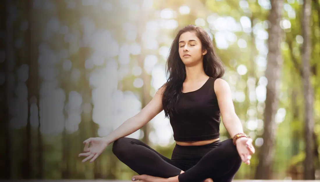 Woman meditating in a serene setting